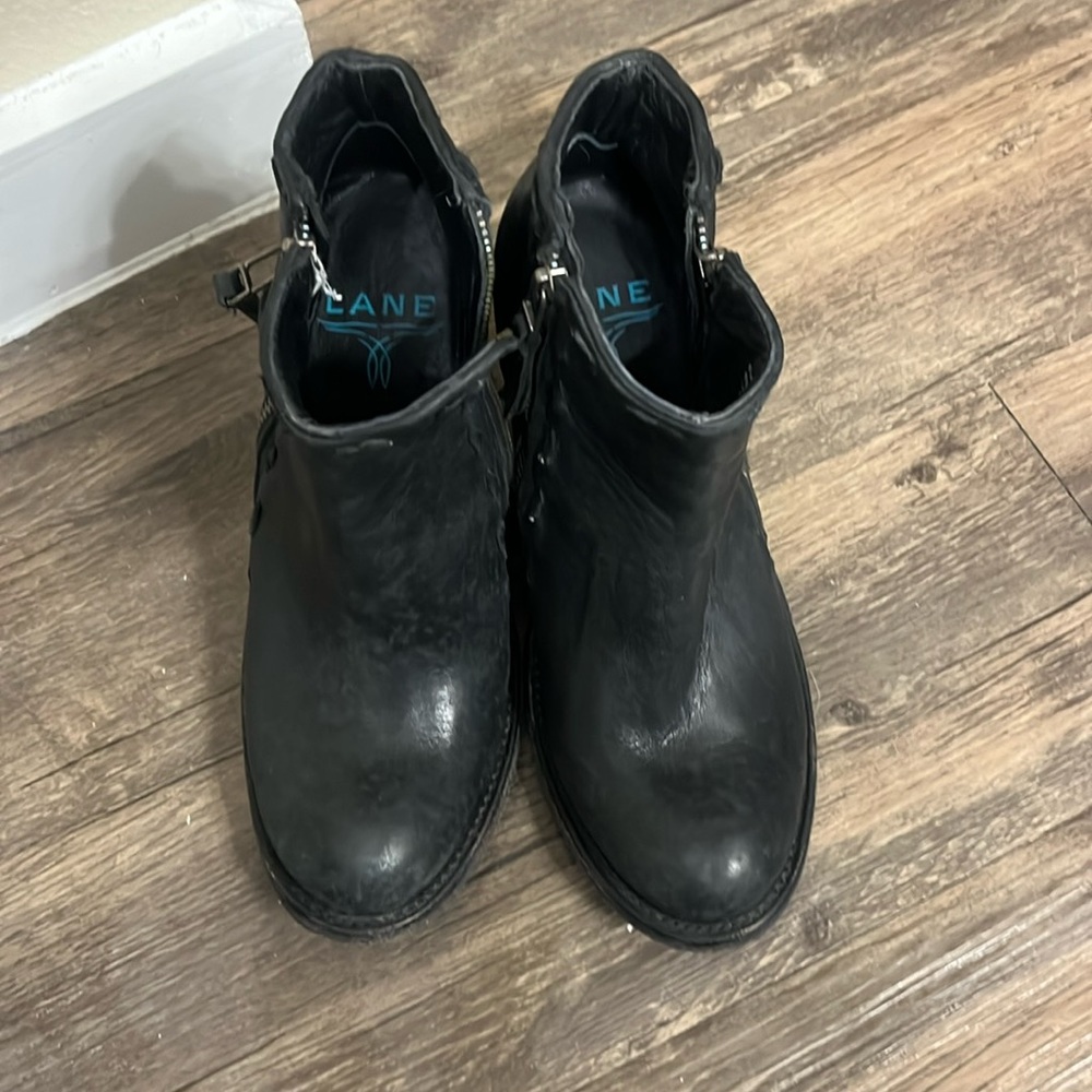 Lane Black heel leather boots.